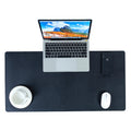 Tapis de bureau noir grand format, présenté avec un ordinateur portable, une souris, un téléphone et une tasse